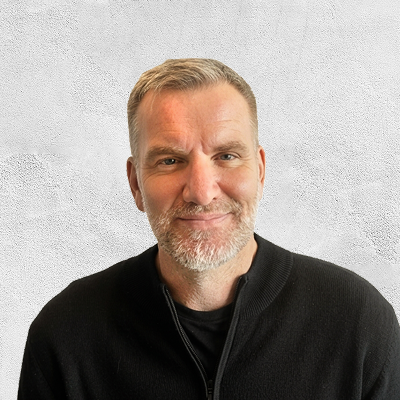 Team headshot example 2, subject placed on warm textured background